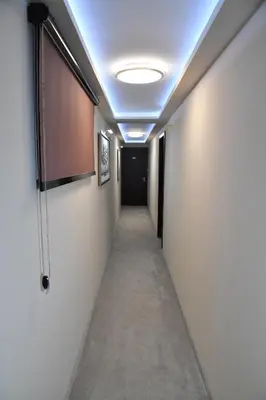 a corridor with a hallway with a ceiling at Exclusive Spot FREE parking in Niš
