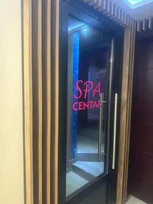 a glass door with a spa center sign on it at Exclusive Spot FREE parking in Niš