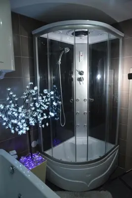 a shower in a bathroom with a glass enclosure at Exclusive Spot FREE parking in Niš