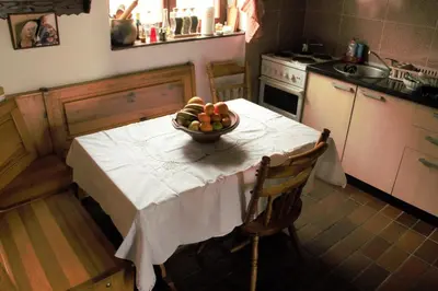 a kitchen with a table with a bowl of fruit on it at Holiday Home Dana Kopaonik in Kopaonik