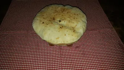a doughnut sitting on top of a red and white table at Guest House Lisinski Raj in Despotovac