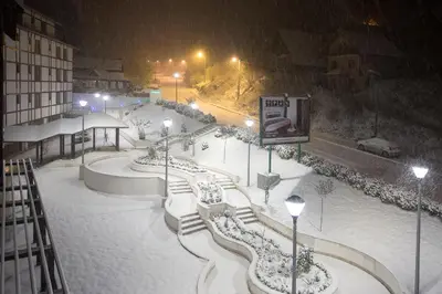 a skate park covered in snow at night at Brzeće Center Apartments in Kopaonik