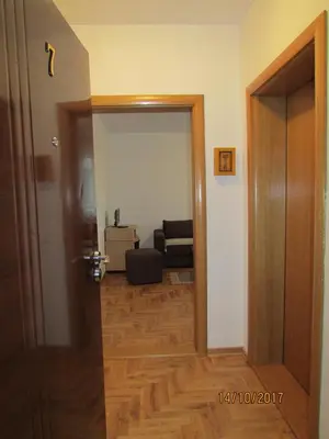 an open door to a living room with a couch at Debora Apartment in Vrnjačka Banja
