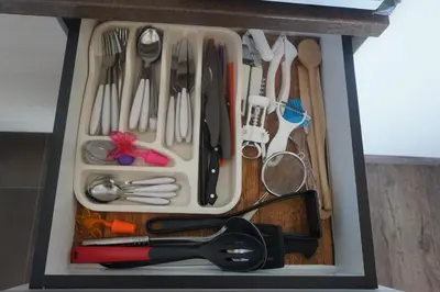 a drawer full of utensils in a box at Apartment F10 Milmari Resort in Kopaonik