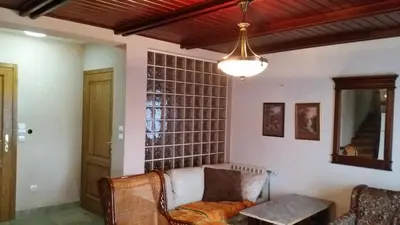 a living room with a couch and a table at Planinski Biser in Kopaonik