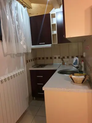 a kitchen with a sink and a counter top at Stara Bačija in Kopaonik