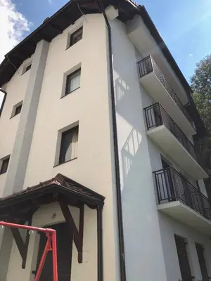 a building with balconies on the side of it at Stara Bačija in Kopaonik