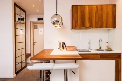a kitchen with a sink and a counter top at Snow White apartments in Kopaonik