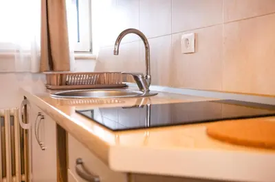 a kitchen with a sink and a counter top at Snow White apartments in Kopaonik