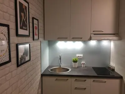 a kitchen with a sink and a counter top at MONI Luxury Apartments in Kopaonik