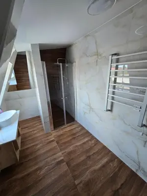 a bathroom with a toilet and a sink and a mirror at Hotel Sax Balkan in Dimitrovgrad