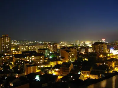 a view of a city at night with lights at Blue New Yorker in Niš