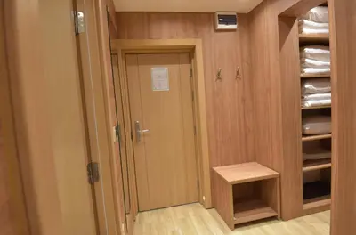 a walk in closet with a door and a pantry at Apartmani Prime in Kopaonik