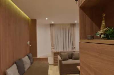 a living room with a couch and a chair at Apartmani Prime in Kopaonik