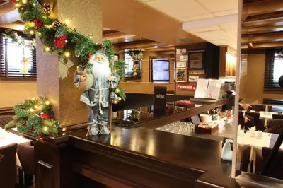 a christmas decoration on a counter in a restaurant at Apart Hotel Mamut in Kopaonik