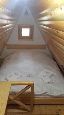 a bed in a room with a window at Dajoda free spa in Kopaonik