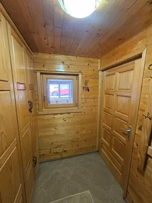 a wooden room with a door and a window at Dajoda free spa in Kopaonik