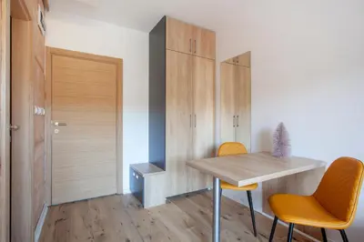 a small room with a table and two chairs at Chalet Vrhovi Kopaonika in Kopaonik