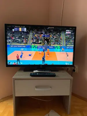 a flat screen tv sitting on top of a table at Apartmani Mićić in Vrnjačka Banja
