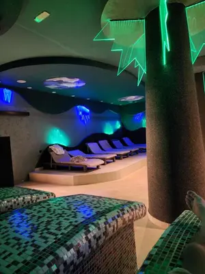 a room with beds and blue lights on the ceiling at Ebra Kraljevi Čardaci Kopaonik in Kopaonik