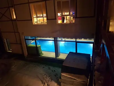 an overhead view of a swimming pool at night at Ebra Kraljevi Čardaci Kopaonik in Kopaonik