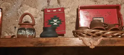 a shelf with a jug and other items on it at Golemi kamik Pirot in Pirot