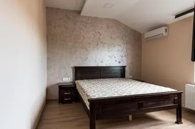 a bedroom with a bed in a room at Prenoćište HRAST in Paraćin