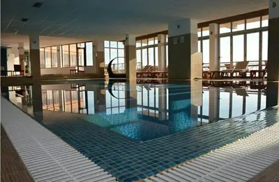 a swimming pool in a building with a poolasteryasteryasteryasteryasteryasteryastery at Apartment M1 MEGI, Milmari Resort in Kopaonik