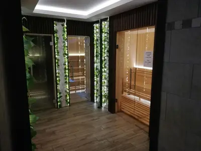 a hallway with a door with plants in it at Katia М14 Milmari Resort in Kopaonik