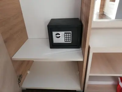 a small microwave sitting on top of a shelf at Katia М14 Milmari Resort in Kopaonik