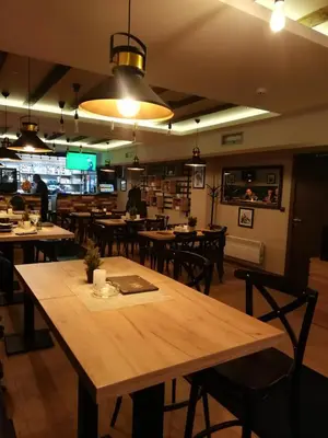 a dining room with tables and chairs in a restaurant at Katia М14 Milmari Resort in Kopaonik
