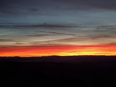 a sunset from the top of a mountain at LUX Apartman B1 Milmari in Kopaonik