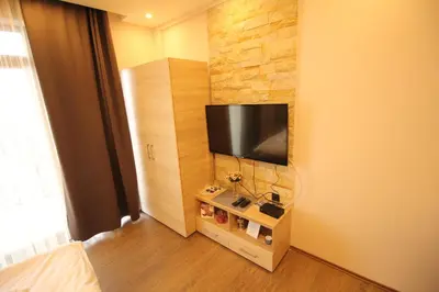 a room with a flat screen tv on a wall at Milmari M18 Kopaonik in Kopaonik