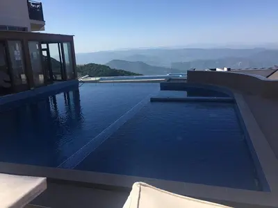 a swimming pool on the side of a building at Apartment Simonida - Milmari M3 in Kopaonik