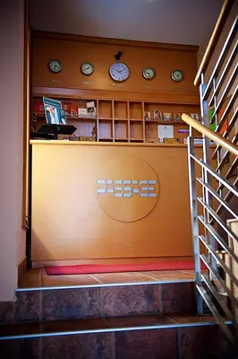 a restaurant with a desk with a sign on it at Apartments Passage in Vrnjačka Banja