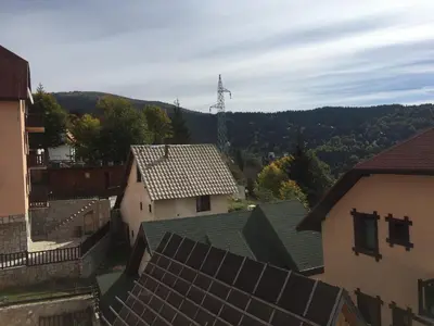 an aerial view of roofs of buildings in a town at SkiTime Apartment in Kopaonik