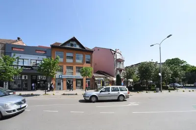 a car parked in a parking lot on a street at City Center Apartments in Pirot
