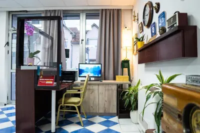 an office with a desk with a computer on it at The Only One Apartments in Niš