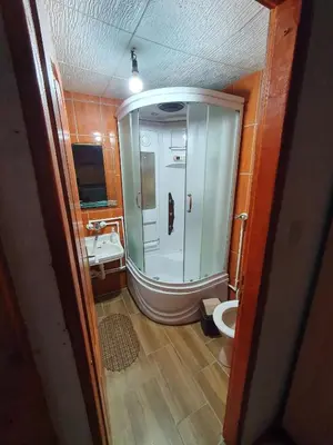 a bathroom with a shower and a toilet at Smeštaj 