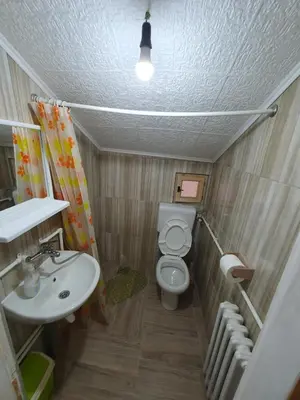 a small bathroom with a toilet and a sink at Smeštaj 