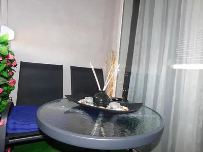 a glass table with a bowl on top of it at Velvet Lux in Niš