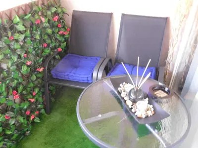 a table and two chairs and a glass table with rocks on it at Velvet Lux in Niš