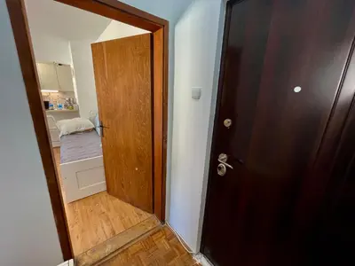 an open door to a room with a bed at Sokobanja Apartman Aleksa in Soko Banja