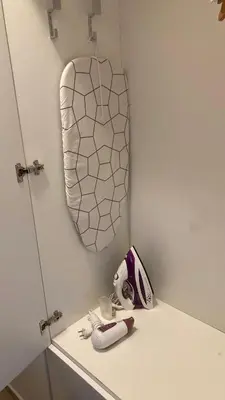 a white counter with a towel hanging on a wall at Apartman Senjak in Pirot