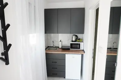 a kitchen with a counter top with a microwave at 