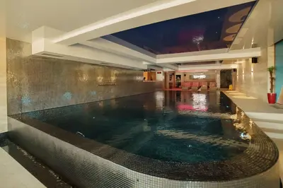 a swimming pool in the middle of a building at Apartment Unna in Kopaonik