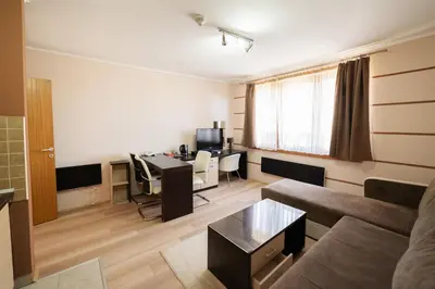 a living room with a couch and a table at Apartment Unna in Kopaonik