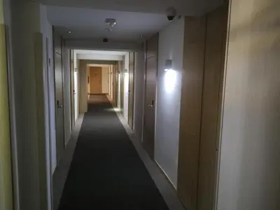 a hallway of a building with a long hallwayngth at Apartments MARAS - Angella Konaci in Kopaonik