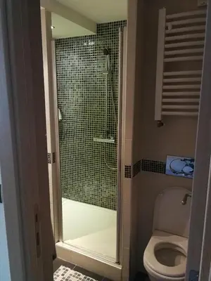 a bathroom with a shower and a toilet in it at Apartments MARAS - Angella Konaci in Kopaonik