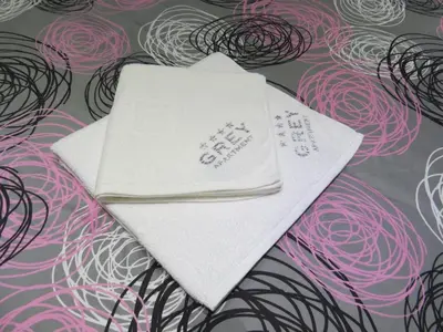 a white napkin on top of a pile of wires at Grey apartment in Niš